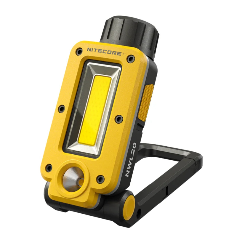 Yellow and black Nitecore work light on a white background