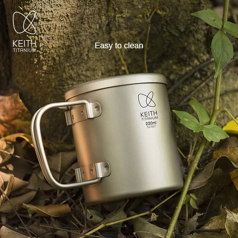 Titanium mug with handle on a natural background, featuring the Keith Titanium brand.