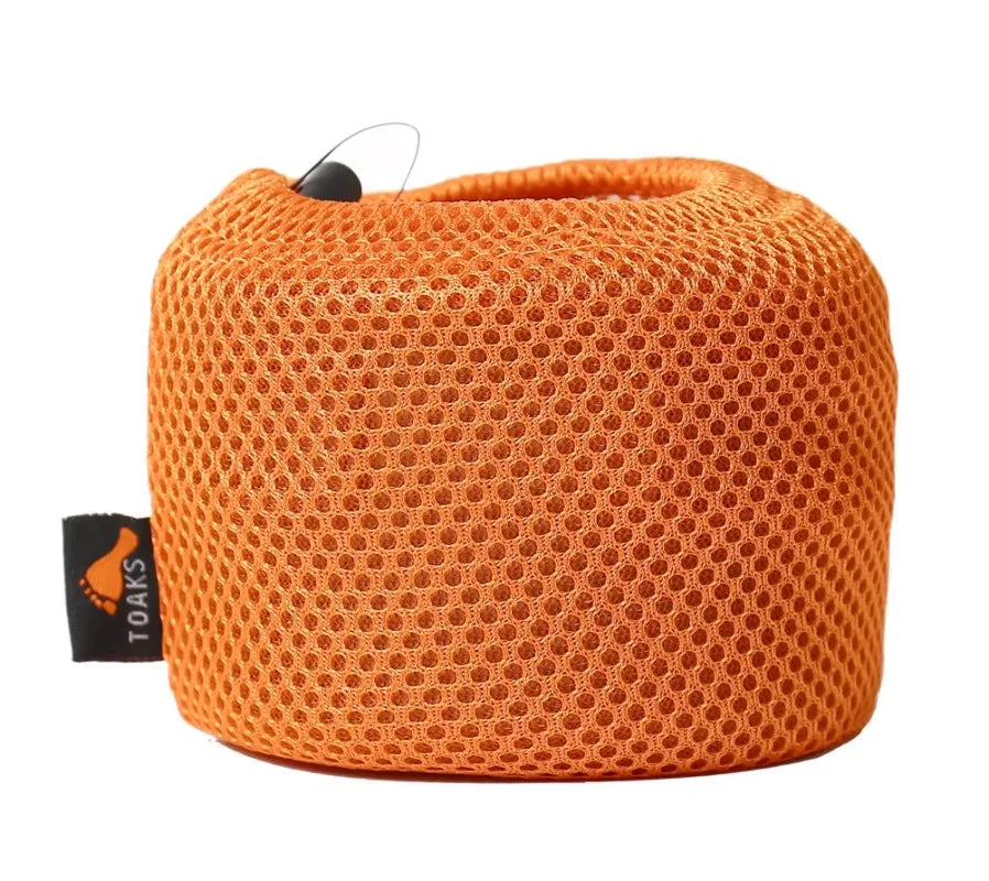 Orange mesh pouch with a visible brand tag on a white background