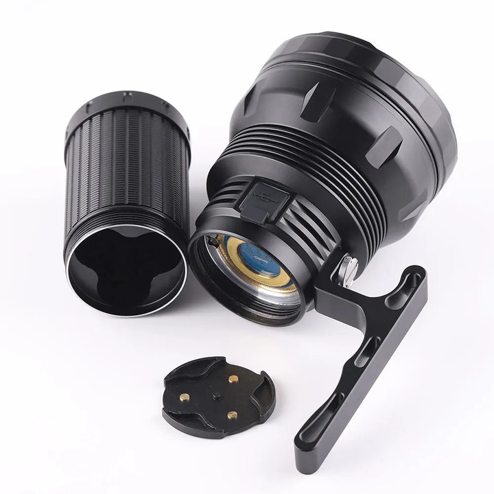 Black flashlight with attachments on a white background