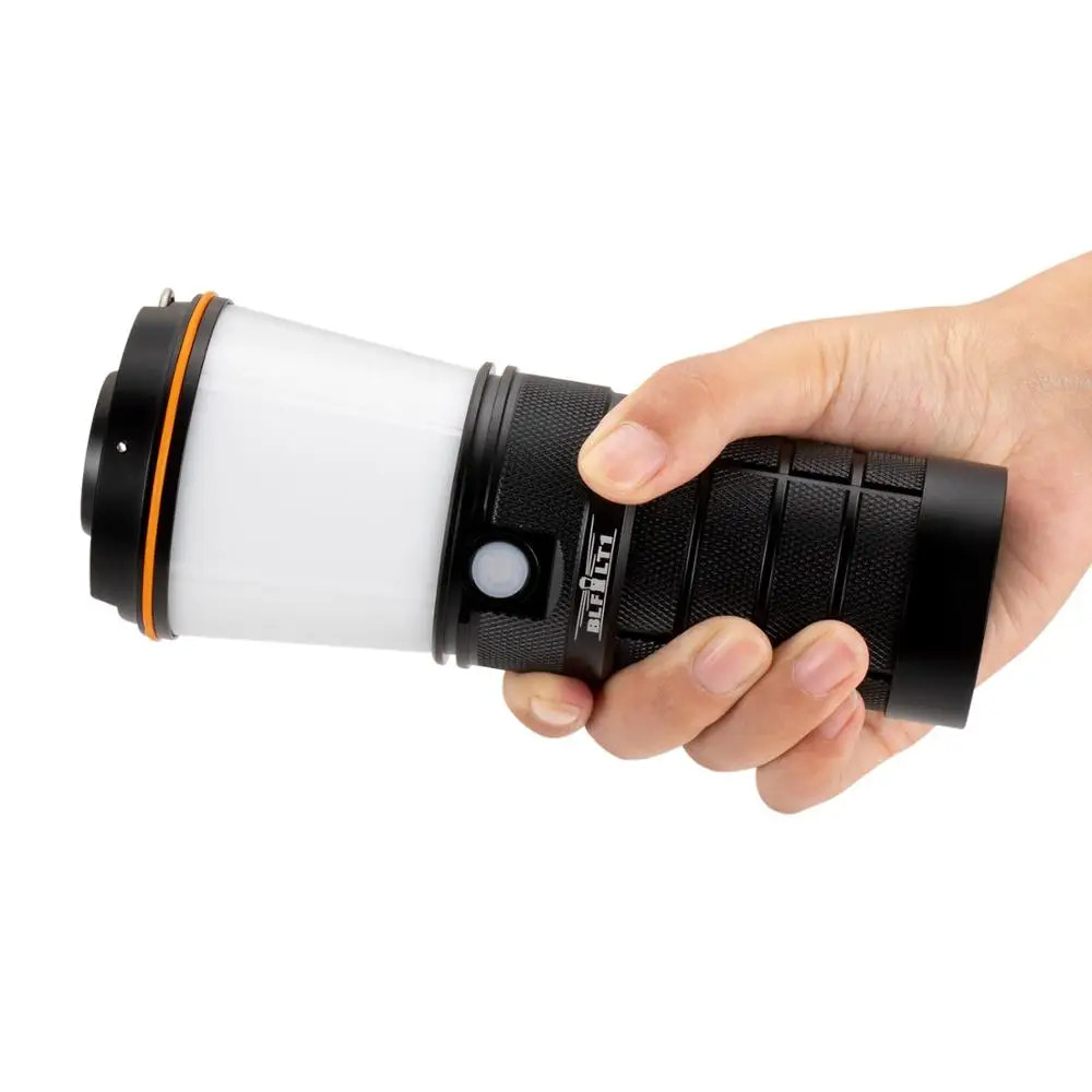 Hand holding a black lantern on a white background