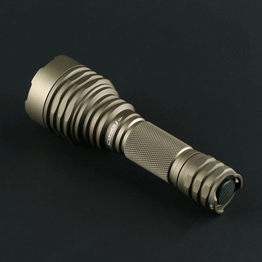 Metallic flashlight on a black background