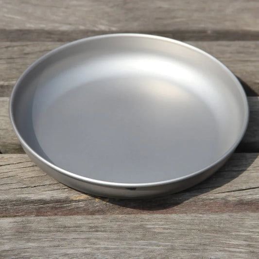 titanium plate on a wooden surface