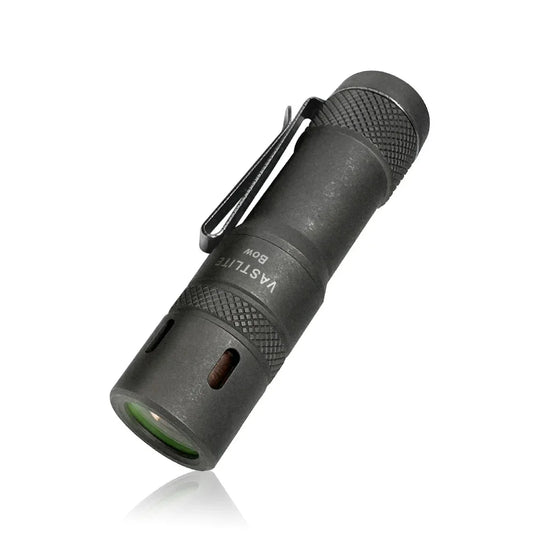 Black flashlight with a clip on a white background