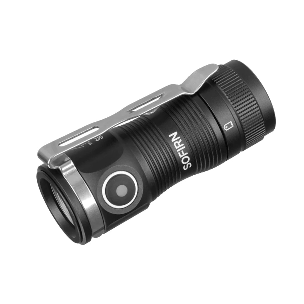 Black flashlight with metallic clip on a white background