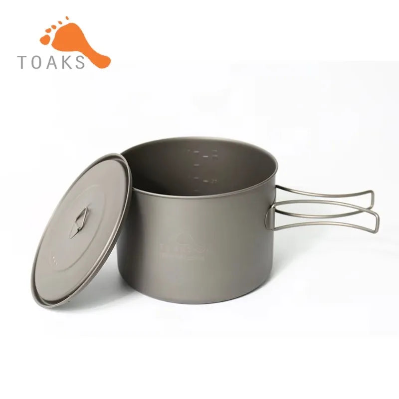 Camping pot with lid on a white background, featuring the Toaks brand.