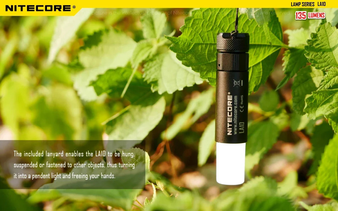 Nitecore flashlight hanging from leaves with product details.