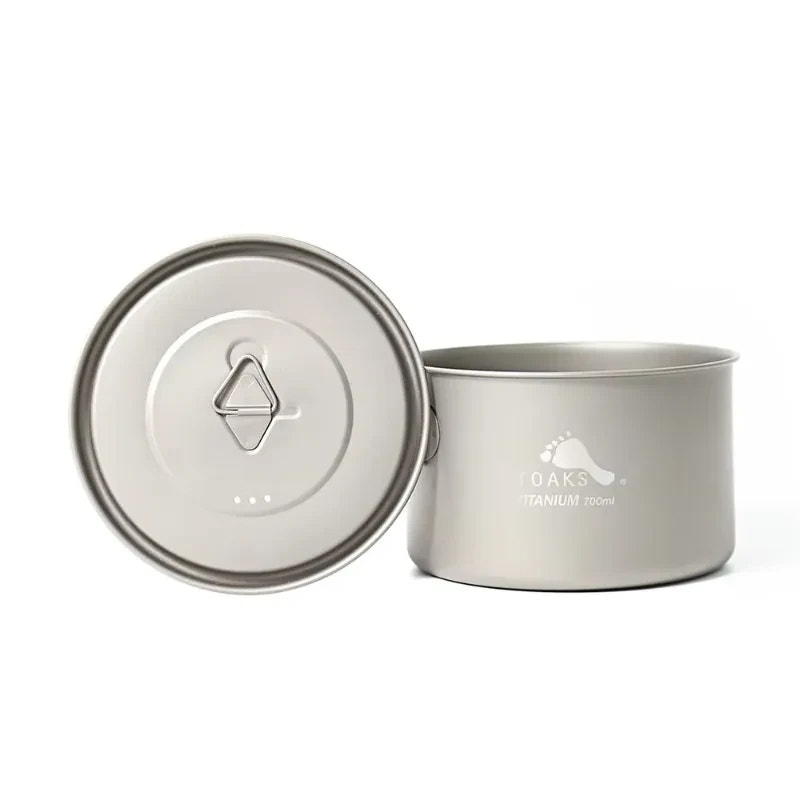 Titanium pot with lid on a white background