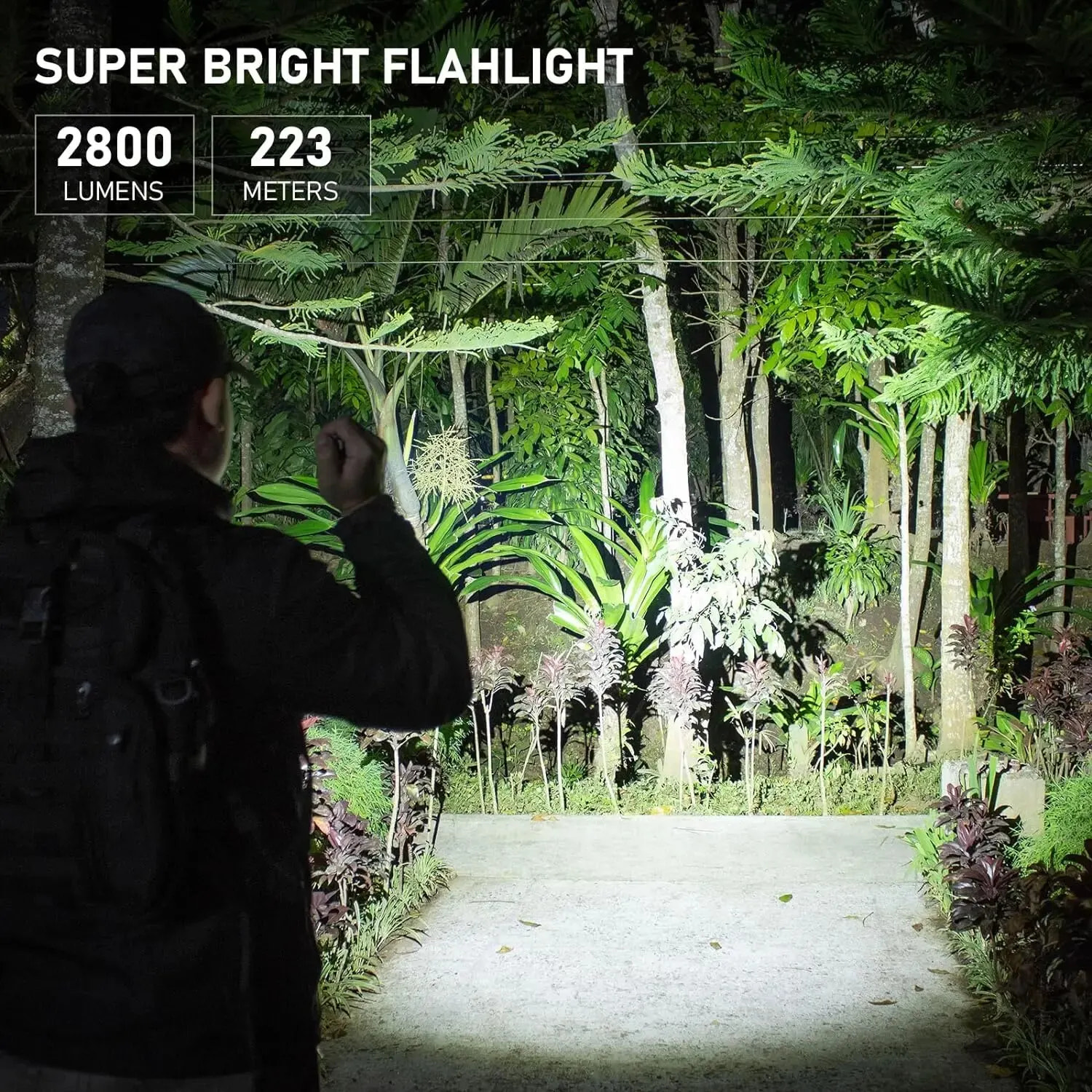 Person using a super bright flashlight in a forest setting