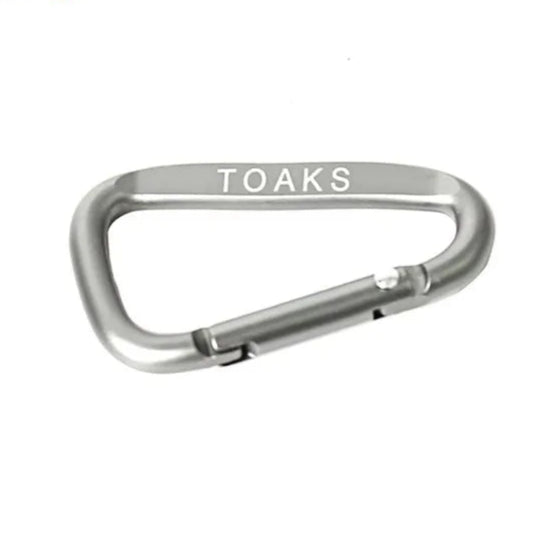Silver carabiner with 'TOAKS' branding on a white background