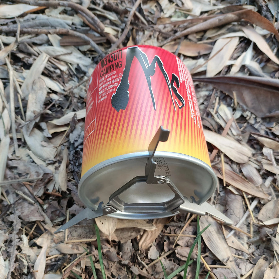 Camping stove on dry leaves