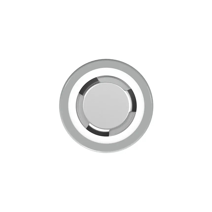 Round metallic object with reflective surface on a white background