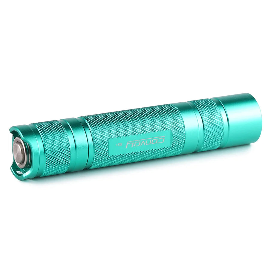 Turquoise flashlight on a white background