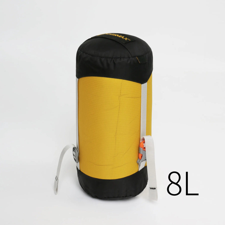 Yellow and black compression bag with '8L' label on a white background