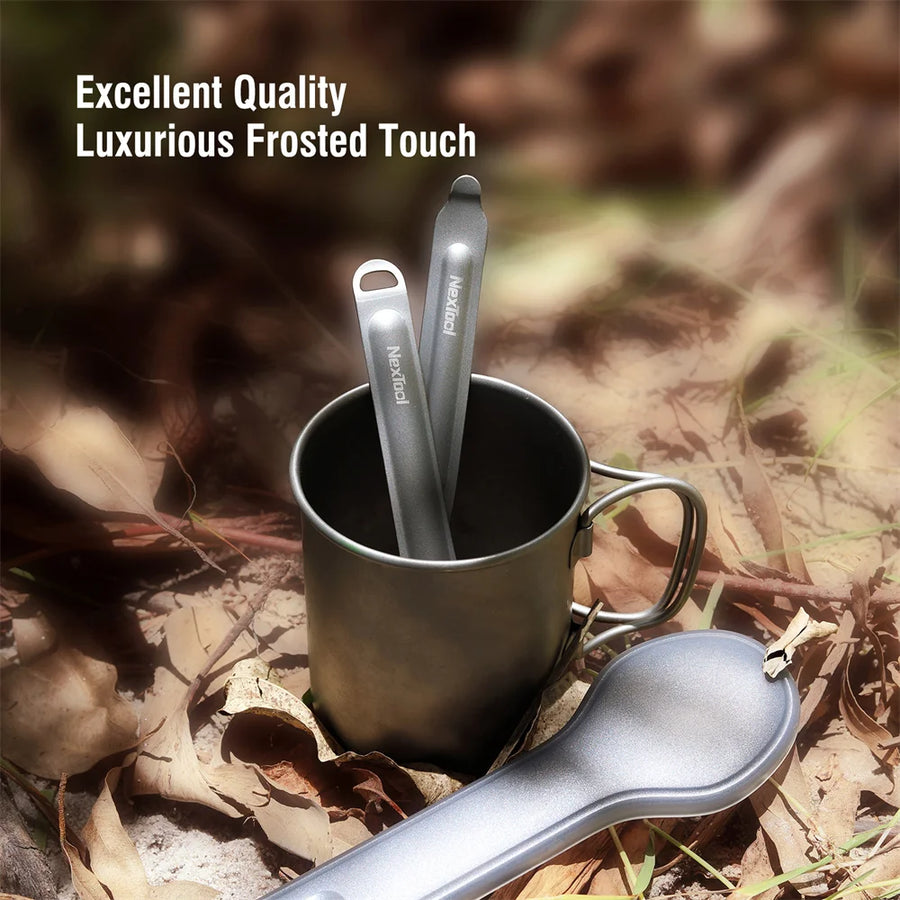 Metal spoon and cup set on a natural background with text about quality and design.