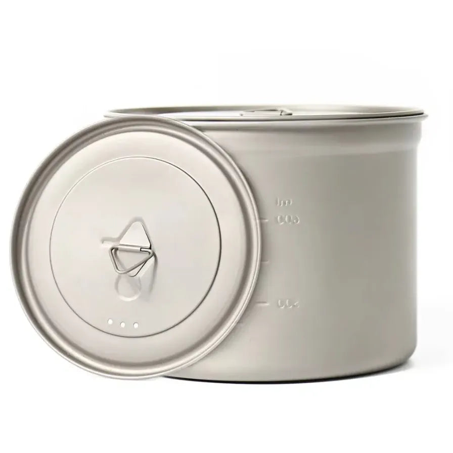Metal pot with lid on a white background