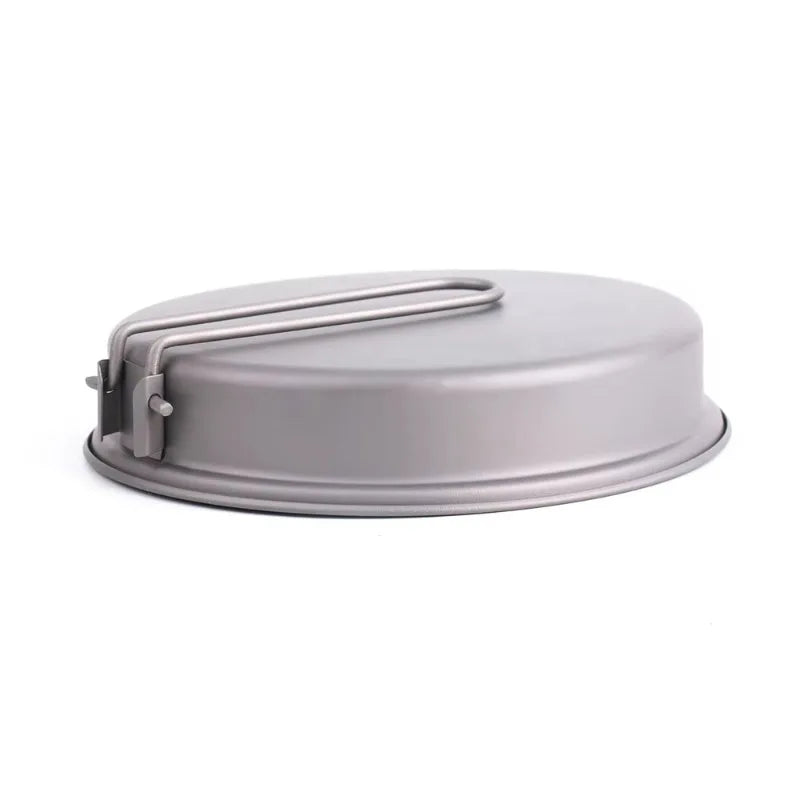Gray metal frying pan with a handle on a white background