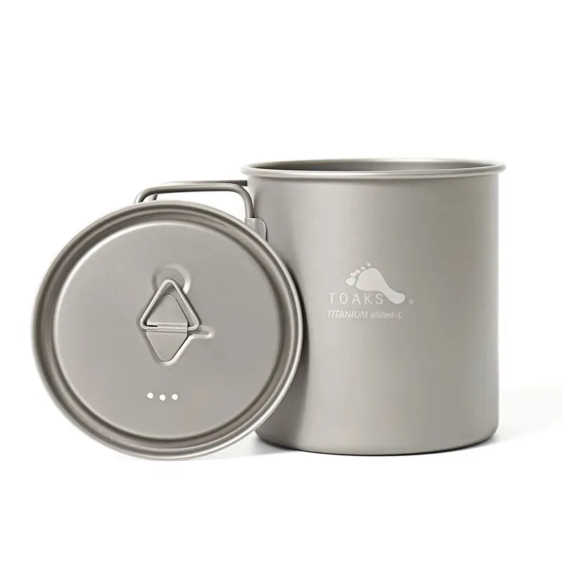Titanium camping pot with lid on a white background