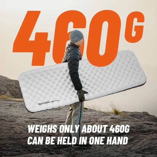 Person holding a lightweight mattress with text indicating weight and portability