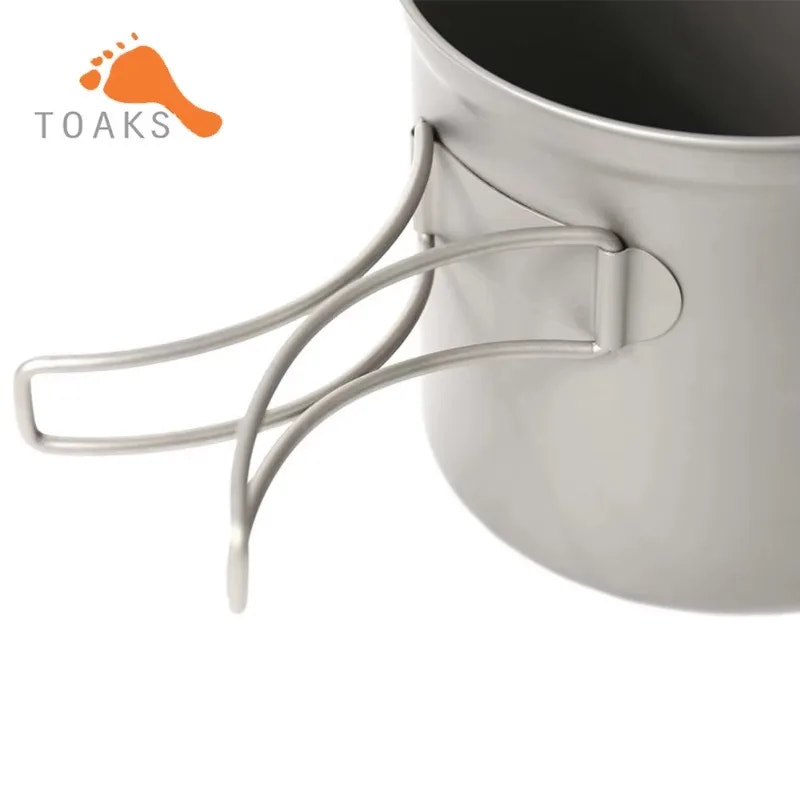 Camping pot with handle and 'TOAKS' logo on a white background