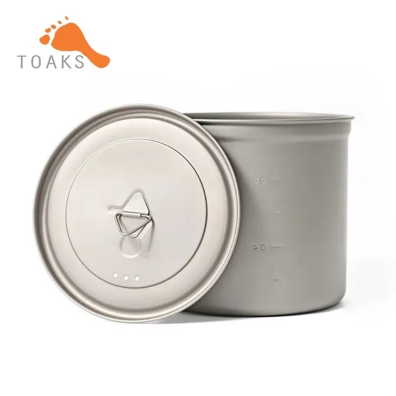 Metal camping pot with lid on a white background, featuring the Toaks brand.