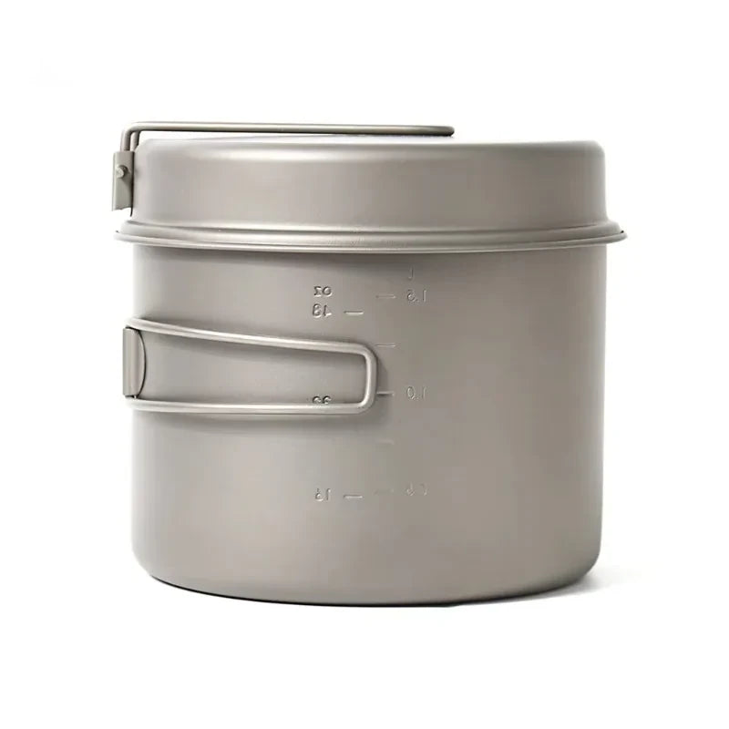 Metal camping pot with handles on a white background