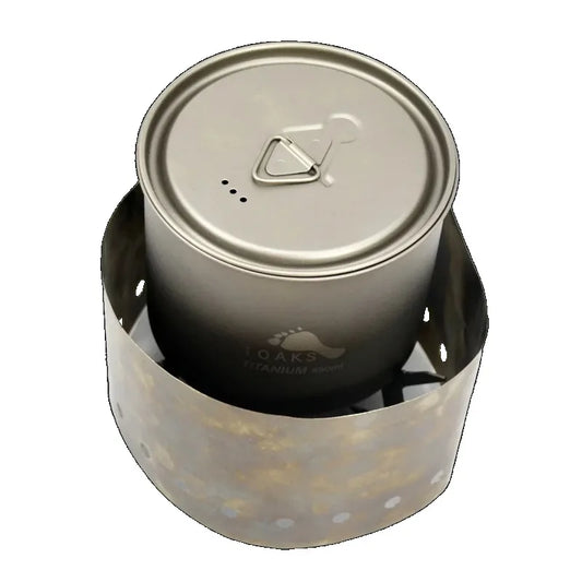 Titanium cook pot with lid on a white background