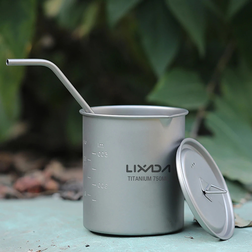 Silver Lixada titanium cup with straw on a natural background