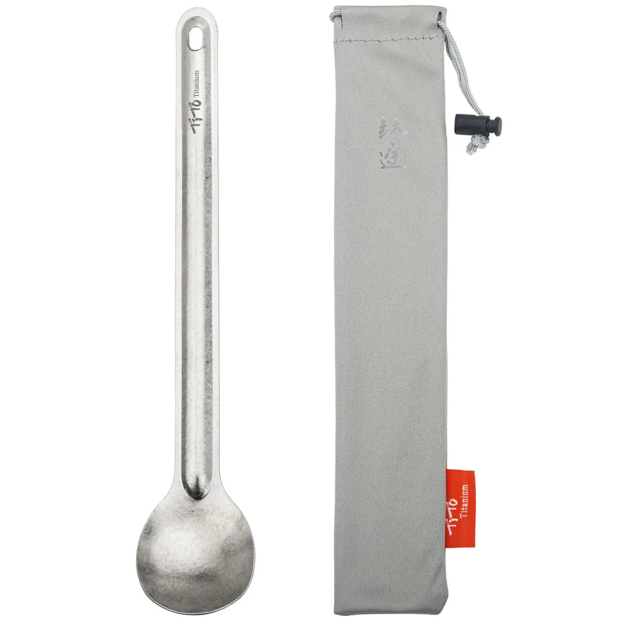 spoon with a gray pouch on a white background