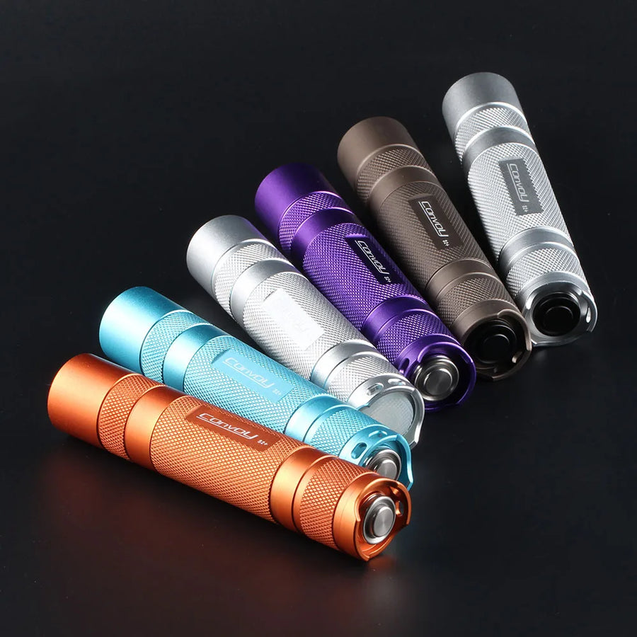 Set of colorful flashlights on a dark background