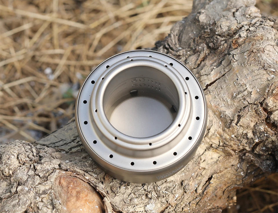 Metallic tool on a wooden surface with 'Titanium' branding.