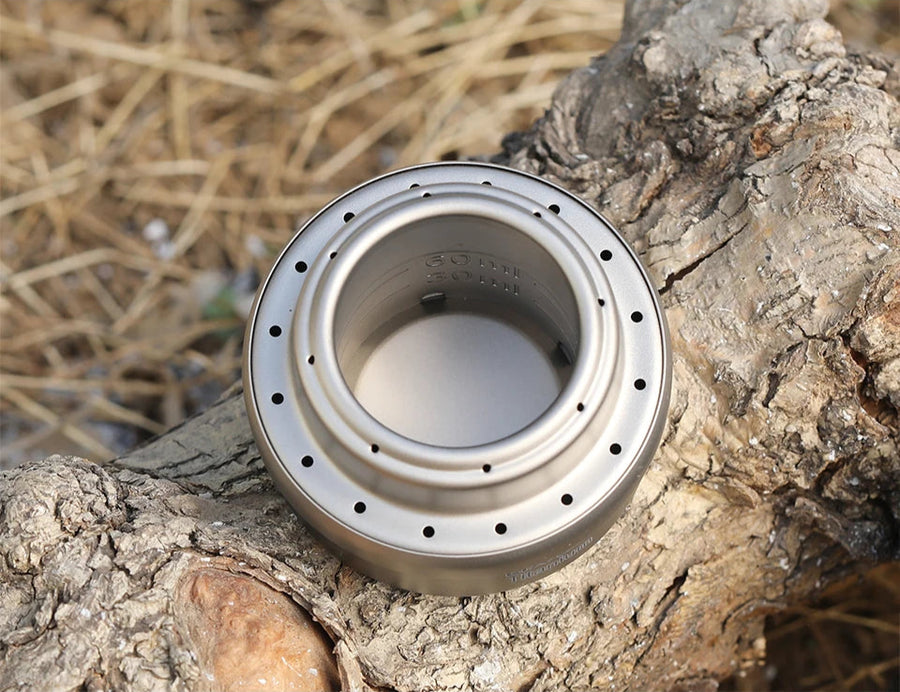 Metallic tool on a wooden surface with 'Titanium' branding.