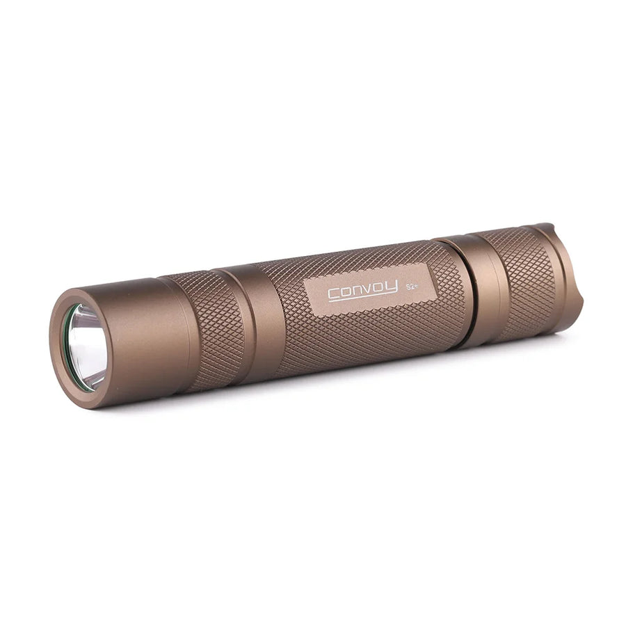 Bronze-colored flashlight with 'Convoy' branding on a white background