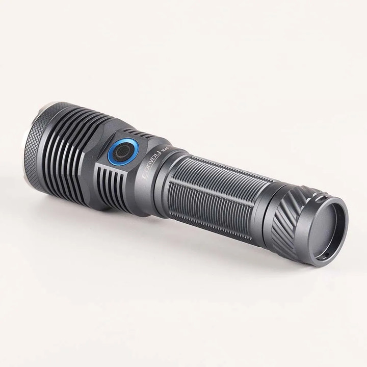 Black flashlight with blue accent on a white background