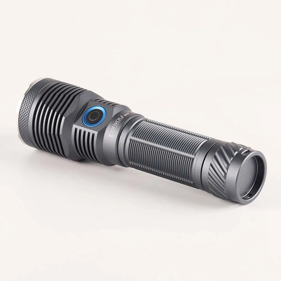 Black flashlight with blue accent on a white background