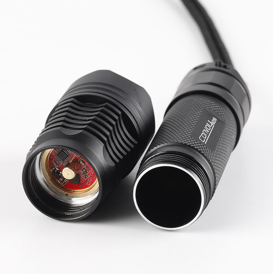 Close-up of a black flashlight with visible branding on a white background