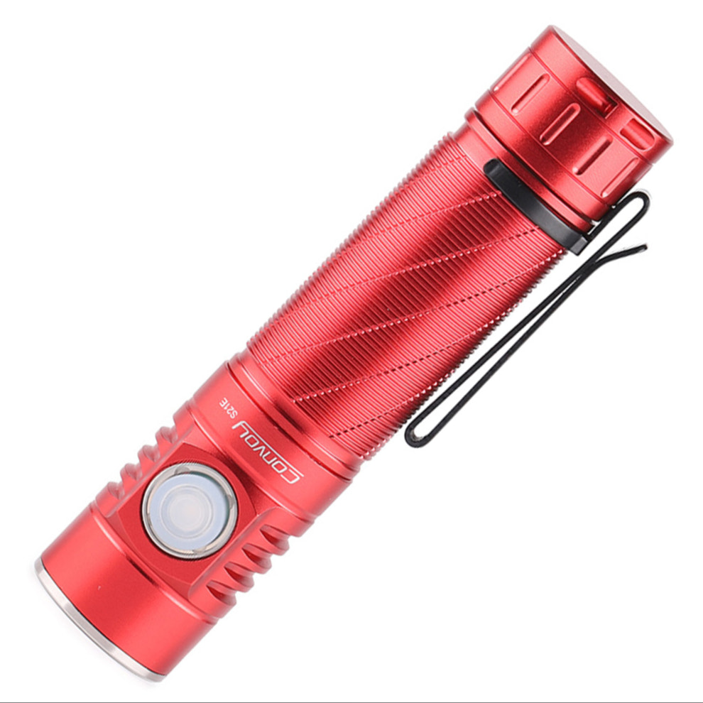 Red flashlight with a textured surface on a white background
