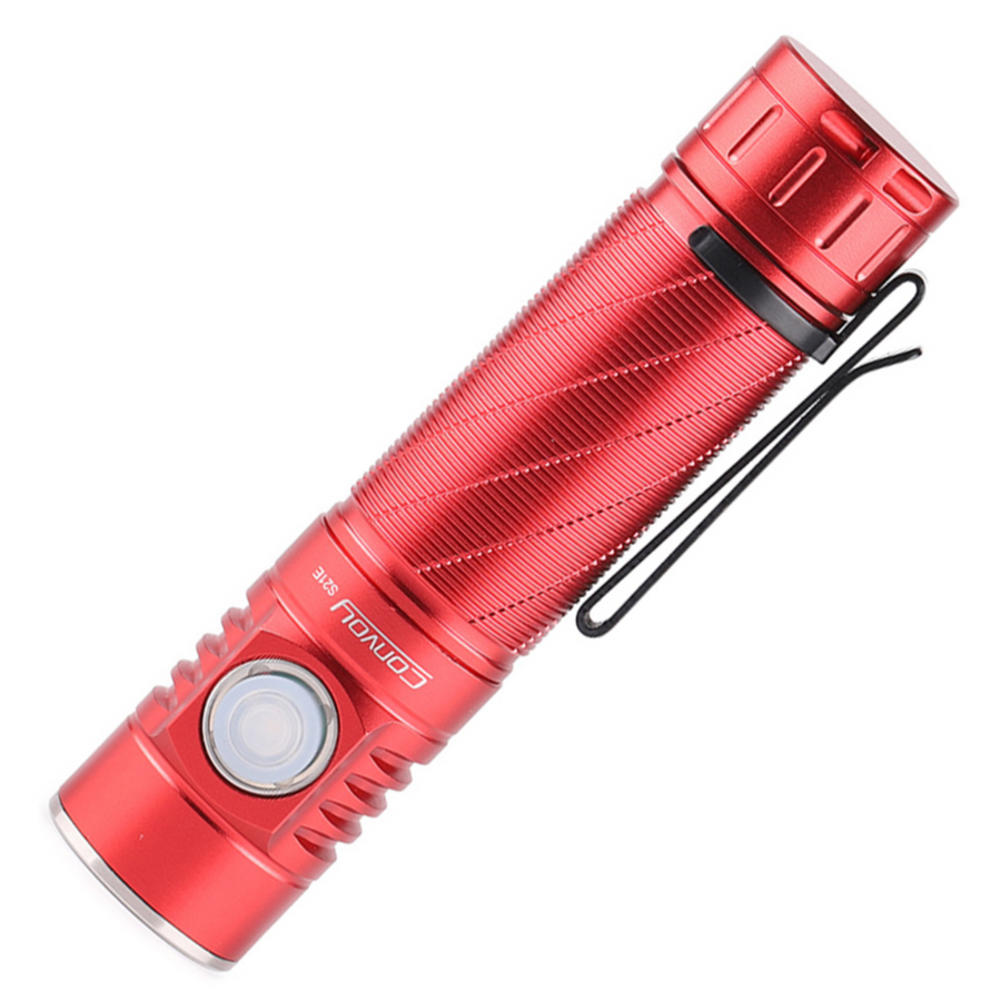 Red flashlight with a textured surface on a white background