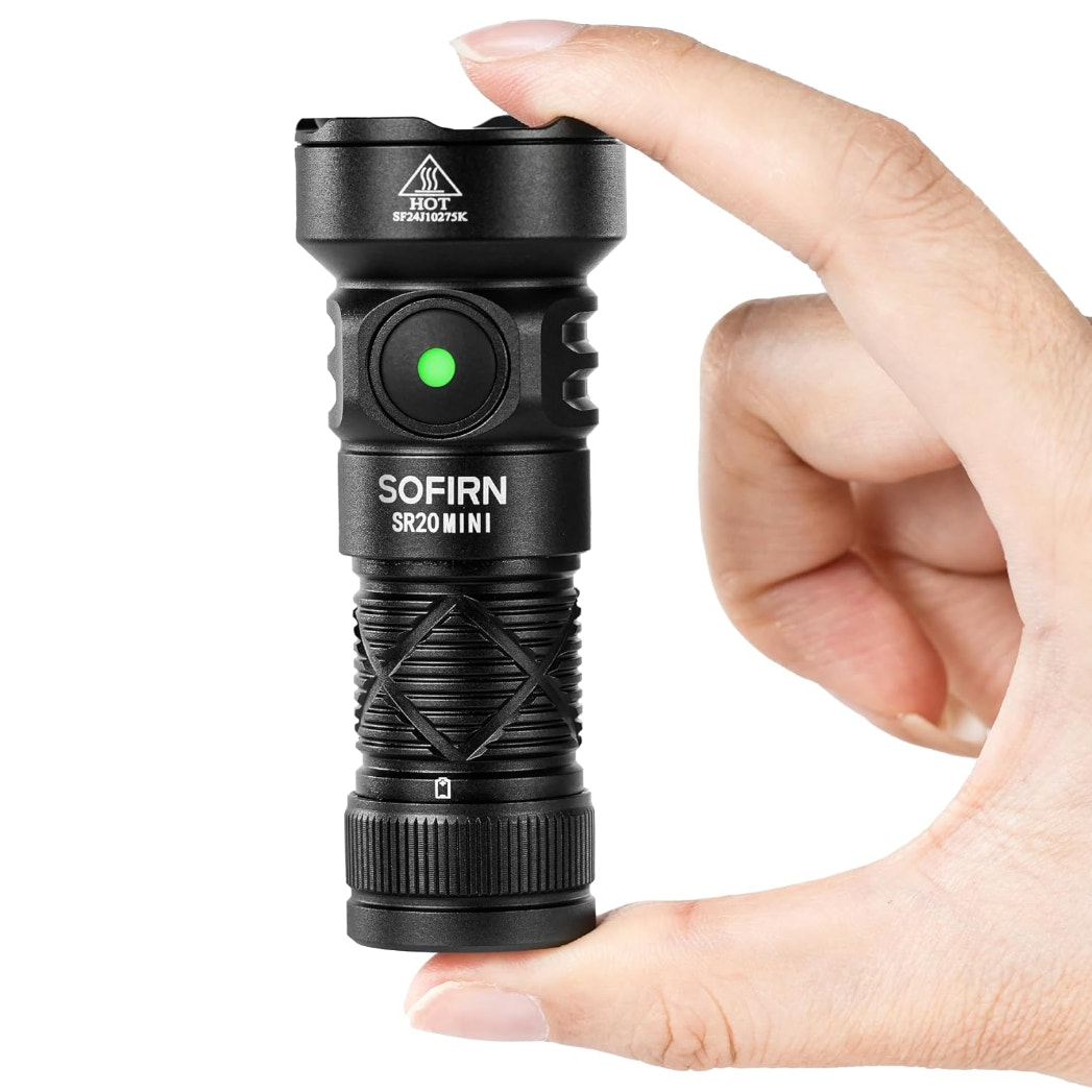Black flashlight with 'SOFIRN' branding held by a hand on a white background