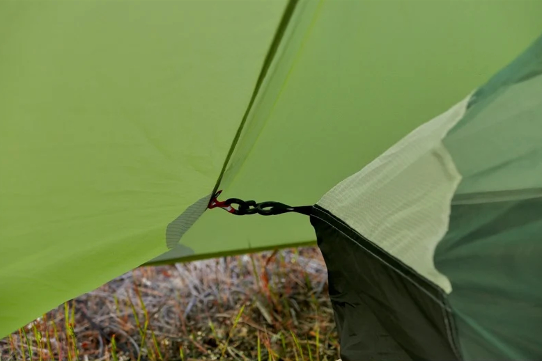 Close-up of a green tent with a blurred natural background