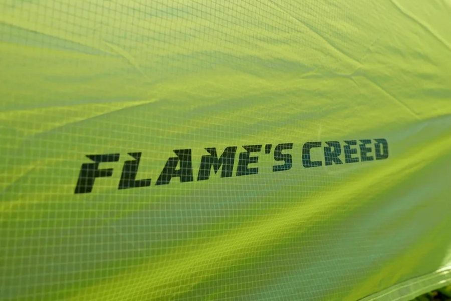 Text 'FLAME'S CREED' on a green background