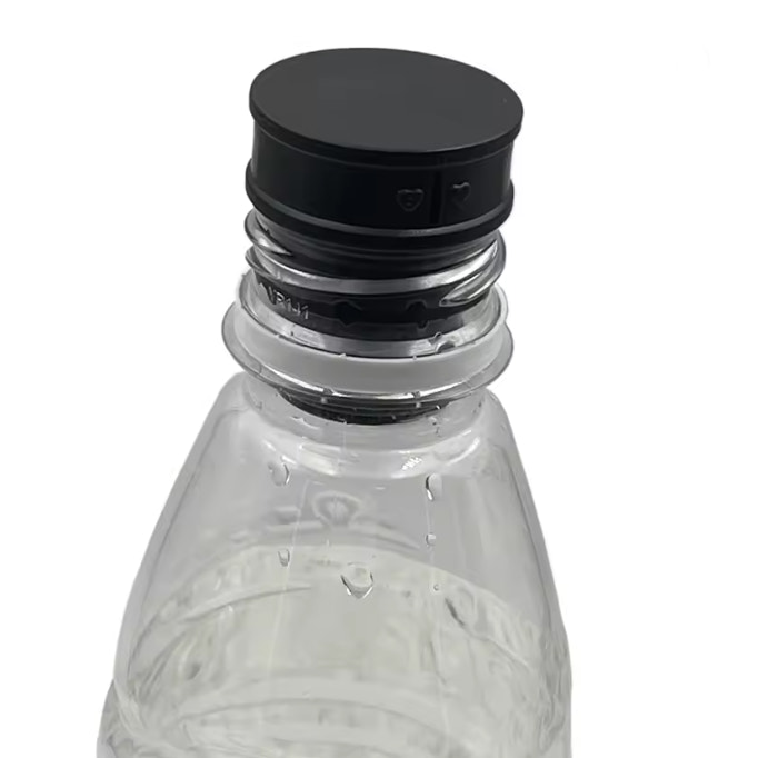 Clear water bottle with black cap on a white background