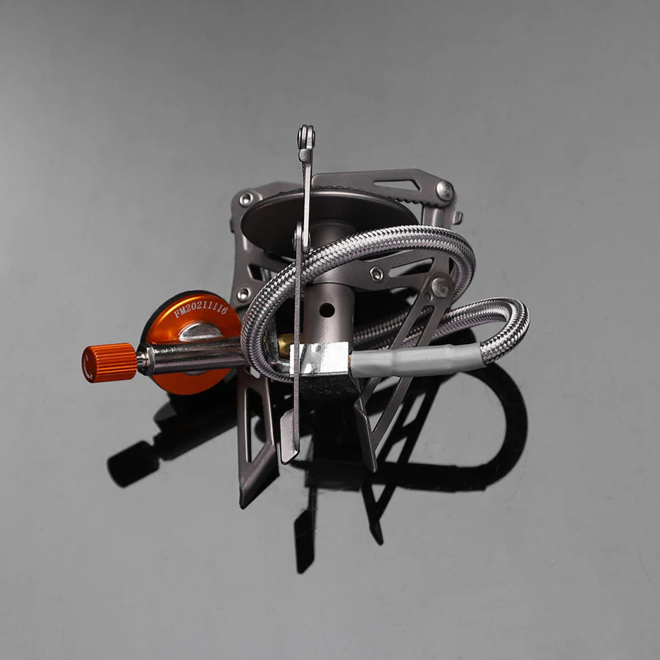 Portable camping stove on a gray background