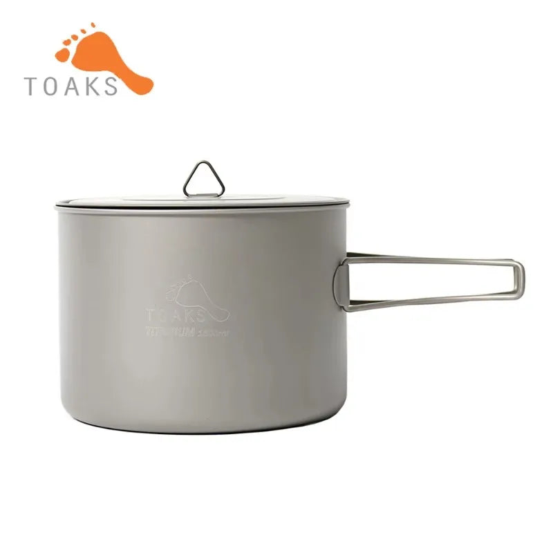 Camping pot with handle and lid on a white background, featuring the Toaks brand.