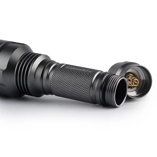 Close-up of a black flashlight on a white background