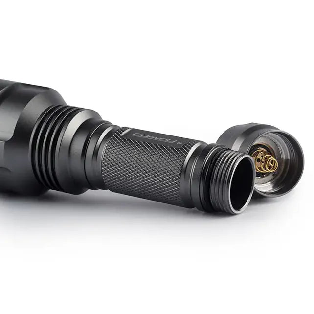 Close-up of a black flashlight on a white background