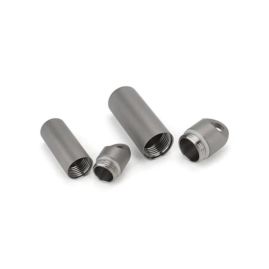 Four metallic cylindrical components on a white background