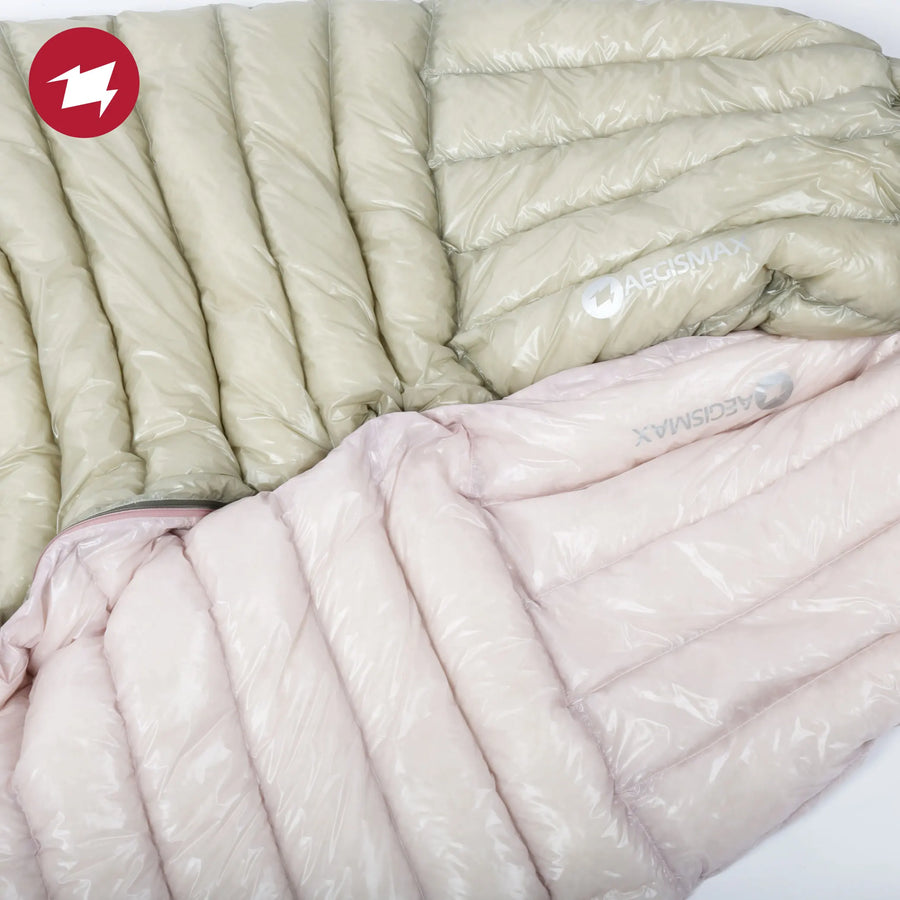 Two sleeping bags, one beige and one pink, on a white background.
