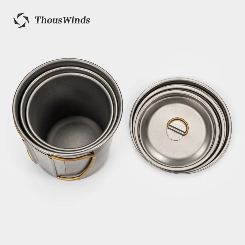 Titanium mugs with lids on a white background, featuring the ThousWinds brand.