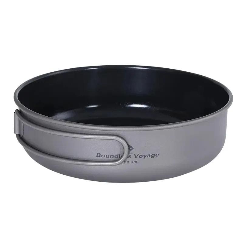 Black camping pot with gray handle on a white background